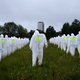 Illustration for article titled Horde of 100 radiation suit-clad specters invades German music festival